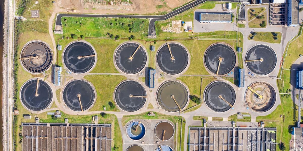 Aerial view of the round settling tanks at a treatment works