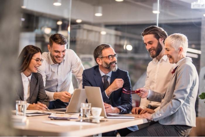 A team around a meeting table planning a sustainability campaign