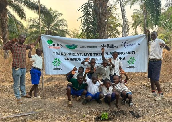 Children and tree planters at a live planting with Friends of Lake Tanganyika, Tanzania
