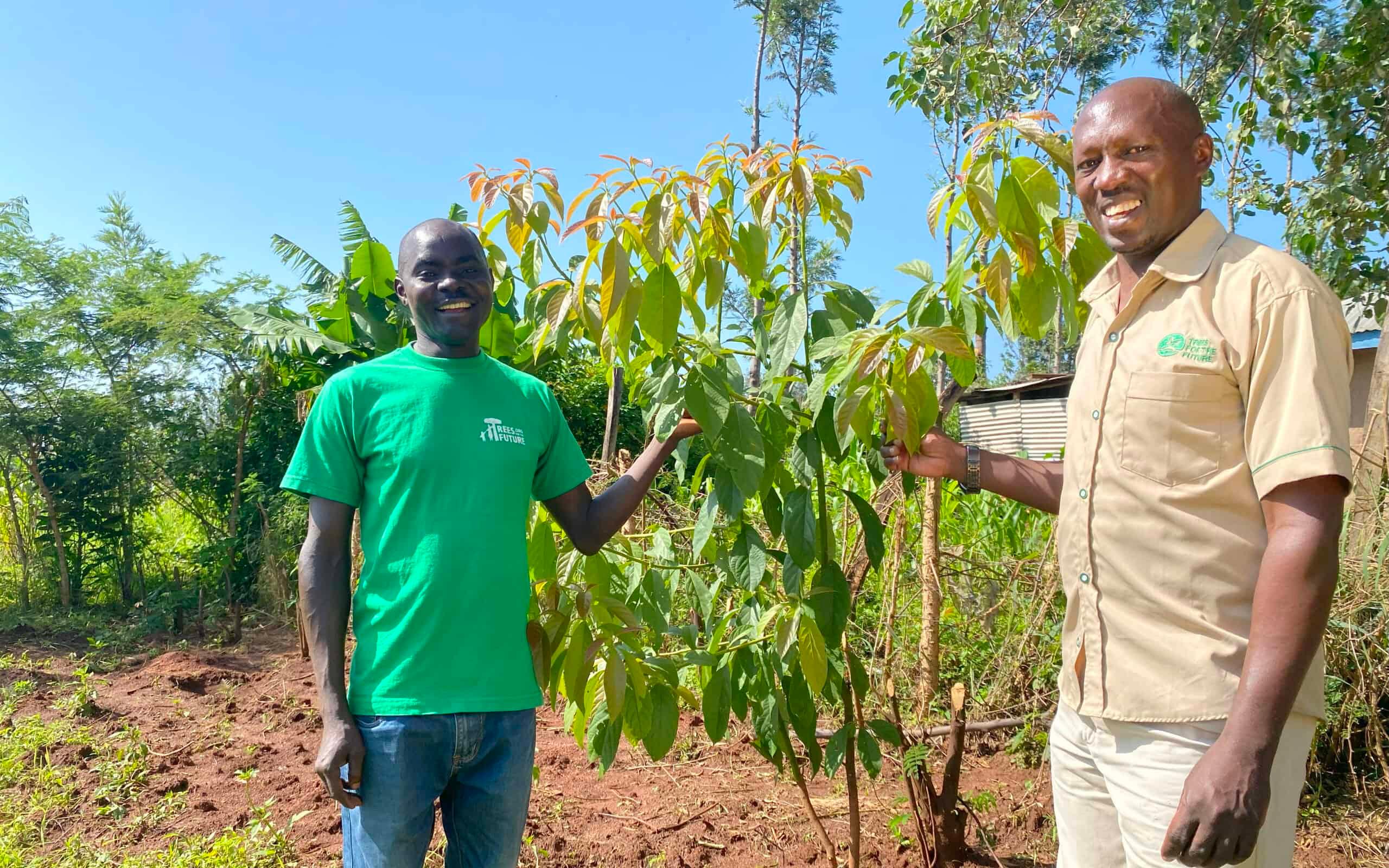 David (left) is part of a larger group of farmers in his community receiving Forest Garden training from Trees for the Future.